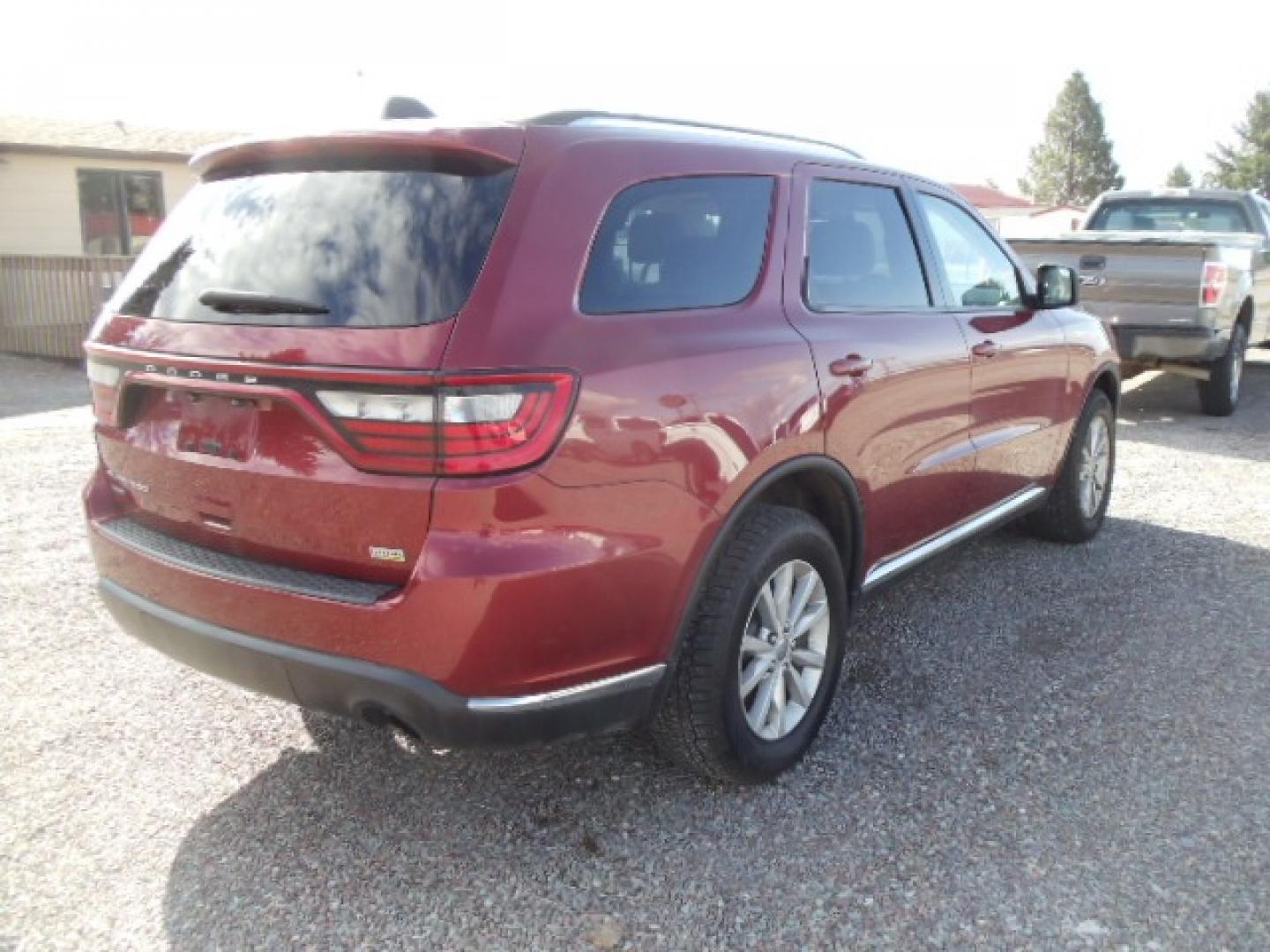 2014 red /Tan Dodge Durango SXT (1C4RDJAG5EC) with an 3.6 L VVT 6 Cylinder engine, Automatic transmission, located at 5465 Highway 2 W., Columbia Falls, MT, 59912, (406) 892-4407, 48.352188, -114.240929 - This SUV was previously owned by the federal government so it has been well maintained and taken care of. This Durango is super clean inside and out with near new tires and low actual miles. This vehicle is a 7 passenger. - Photo#6